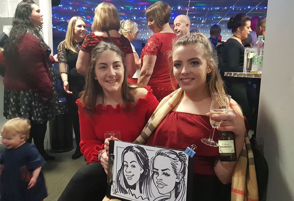 Live caricatures of 2 girls